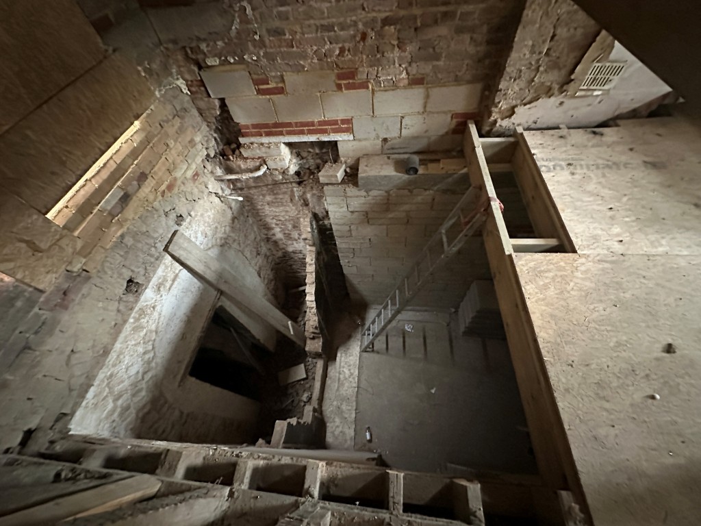 Lot: 144 - DETACHED BUILDING IN NEED OF REPAIR AND REFURBISHMENT WITH APPROVED PLANNING - View into basement from first floor